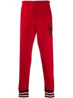 Alexander McQueen skull print track pants - Red - thumbnail